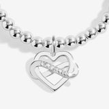 Joma jewellery stretch beaded bracelet with hanging heart infinity charm presented on a foil stamped sentiment card.
