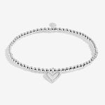 Joma jewellery beaded stretch bracelet with hanging heart charm with sparkle detail presented on a foil stamped sentiment card.