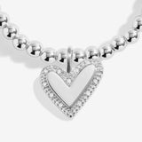 Joma jewellery beaded stretch bracelet with hanging heart charm with sparkle detail presented on a foil stamped sentiment card.