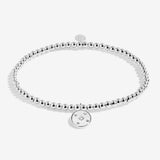 Joma jewellery beaded stretch bracelet with hanging solid disc charm with engraved sparkly stars presented on foil stamped sentiment card.