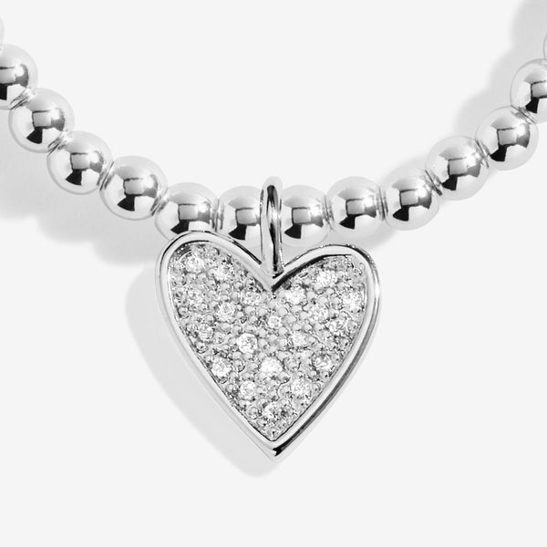 Joma Jewellery Christmas Season To Sparkle beaded bracelet with haning heart charm presented on festive sentiment card.