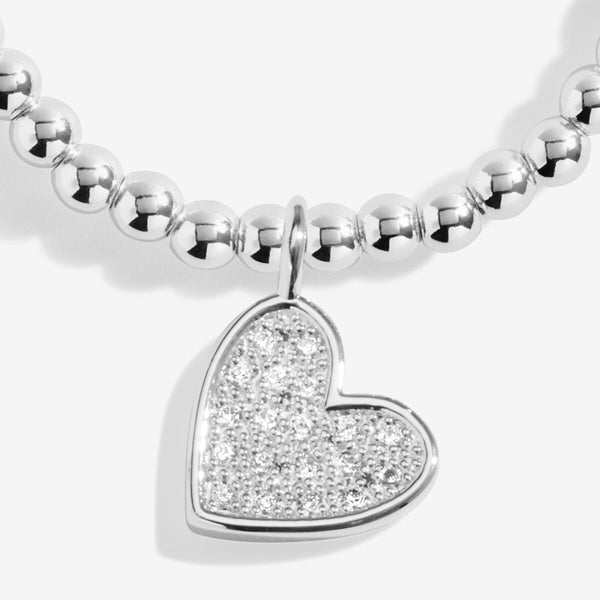 Merry Christmas Lovely Daughter Joma bracelet with silver plated beads and sparkling hanging heart charm.