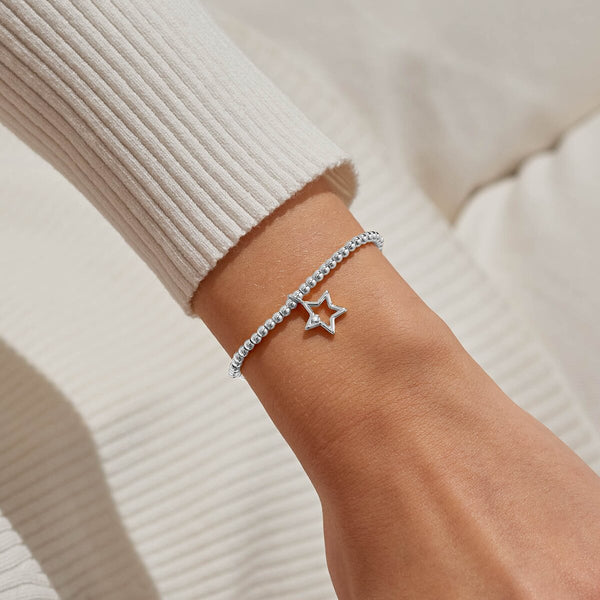 Joma Jewellery stretch beaded bracelet for Secret Santa with open star charm and presented on a festive gifting card.