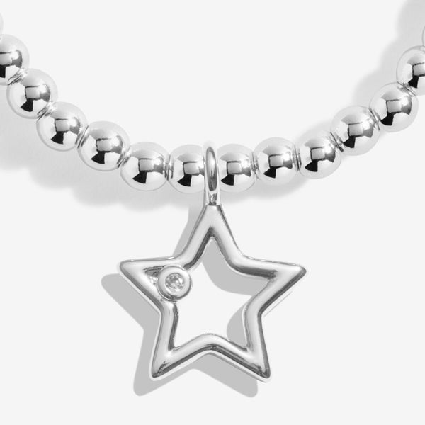 Joma Jewellery stretch beaded bracelet for Secret Santa with open star charm and presented on a festive gifting card.
