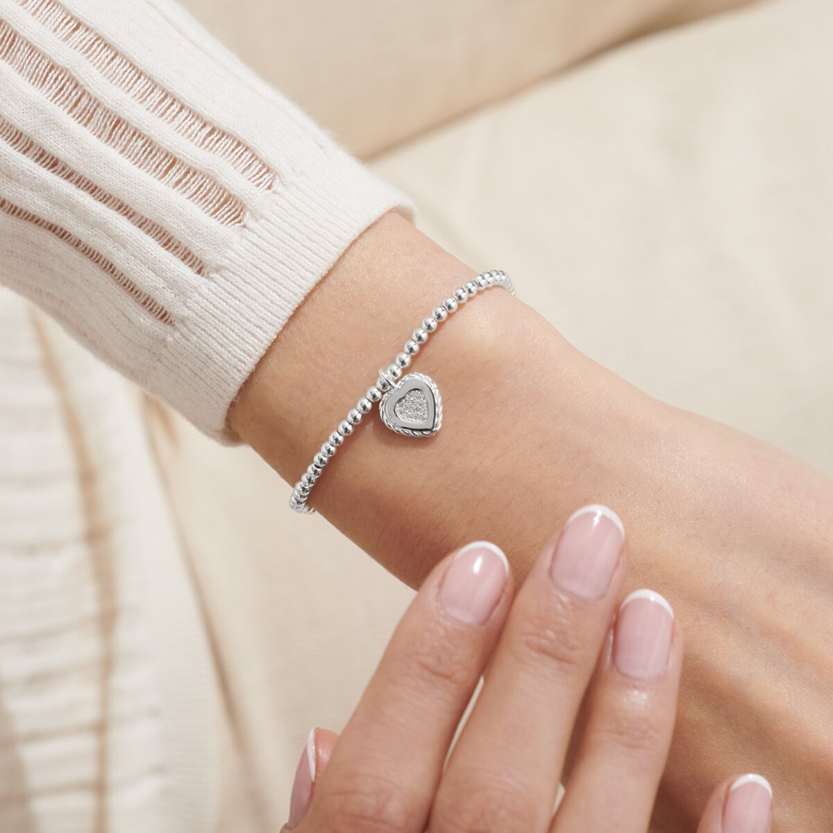 Joma Jewellery stretch beaded bracelet for a Wonderful Nana with solid hanging heart charm with sparkle detail presented on a foil stamped sentiment card.
