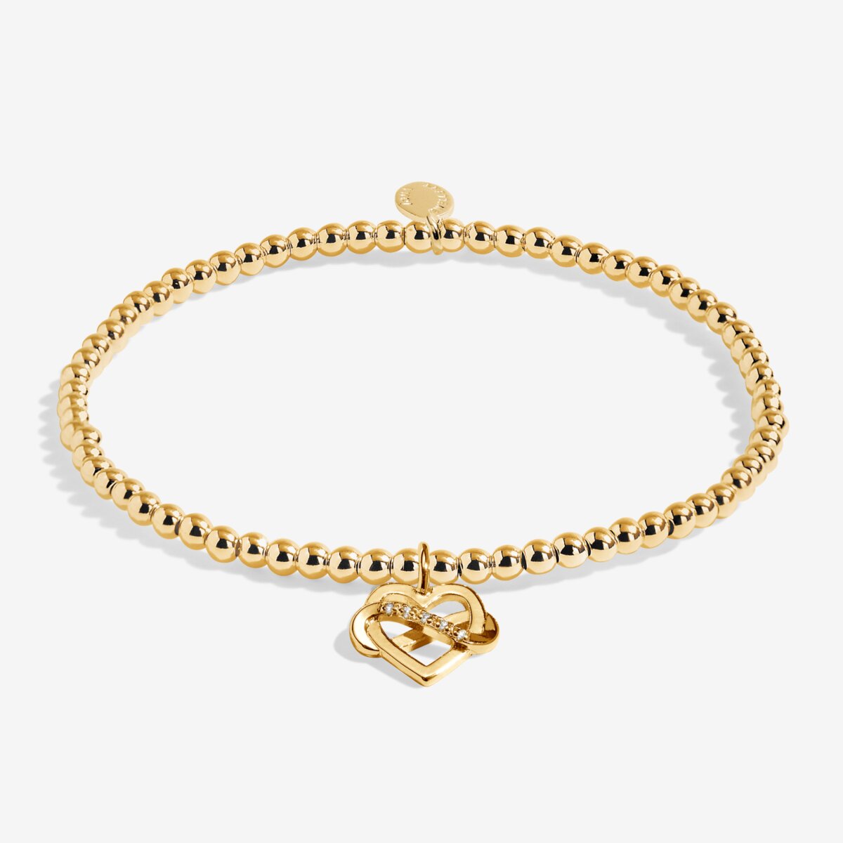 Gold plated Joma Jewellery bracelet with open heart hanging charm with infinity symbol and sparkle detail. Presented on a foil stamped sentiment card.