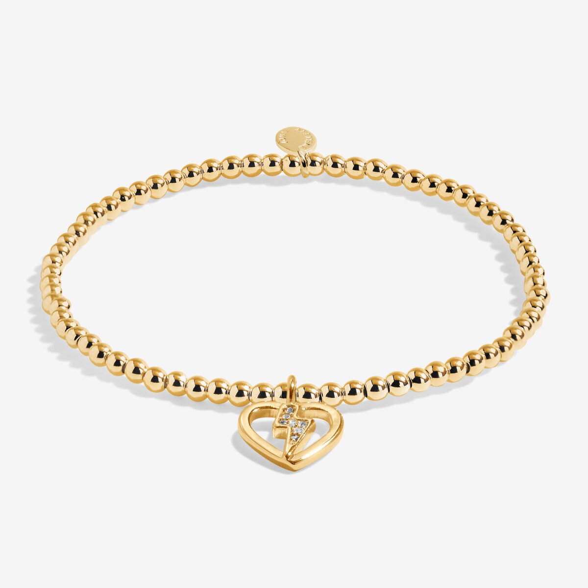 Gold plated Joma Jewellery bracelet with open hanging heart charm with sparkling lightning bolt. Presented on a foil stamped sentiment card.