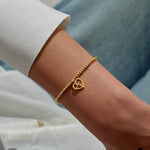 Gold plated Joma Jewellery bracelet with open hanging heart charm with sparkling lightning bolt. Presented on a foil stamped sentiment card.