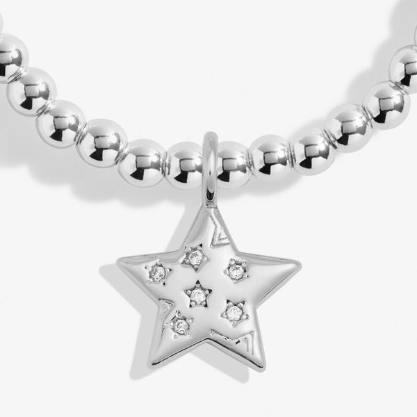 Joma Jewellery Merry Christmas teacher silver plated beaded bracelet with sparkling hanging star charm presented on festive gifting card.