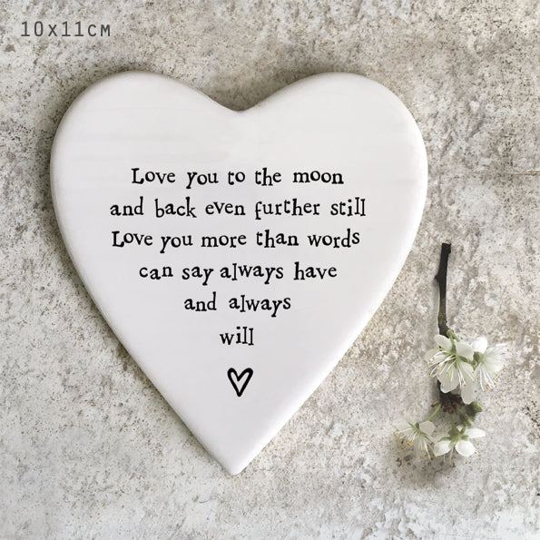 White porcelain coaster with black text which reads 'Love you to the moon and back even further still love you more than words can say always have and always will'
