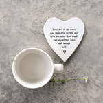 White porcelain coaster with black text which reads 'Love you to the moon and back even further still love you more than words can say always have and always will'