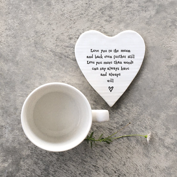 White porcelain coaster with black text which reads 'Love you to the moon and back even further still love you more than words can say always have and always will'