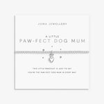 beaded silver bracelet with silver charm of a dog sitting on a heart presented on a white sentiment card embossed with silver foil elements. the card reads 'a little paw-fect dog mum'