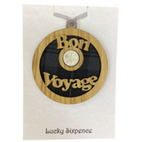 A unique keepsake gift with a Scottish twist.  The sixpence is mounted onto a round hanging oak veneered wood with tartan insert, mounted on card and packaged in clear cellophane packets.  'Bon Voyage' is laser cut into the wooden hanging.