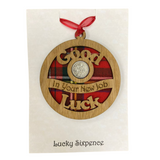 A unique keepsake gift with a Scottish twist.  The sixpence is mounted onto a round hanging oak veneered wood with tartan inserts, mounted on card and packaged in clear cellophane packets.  'Good luck in your new jobt' is laser cut into the wooden hanging.