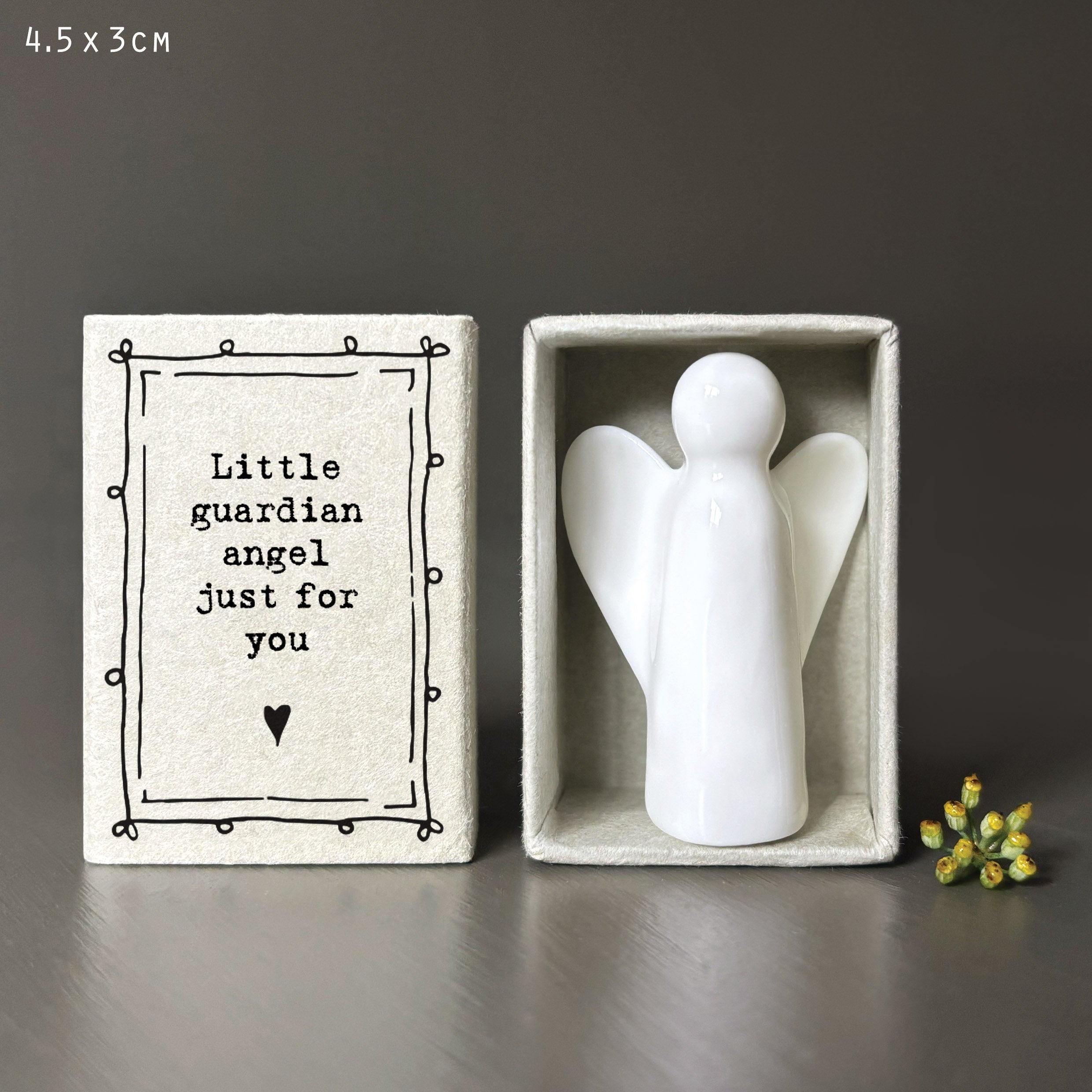White porcelain angel in cardboard match box
