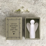 White porcelain angel in cardboard match box