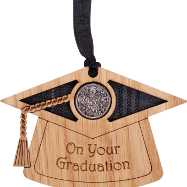 Wooden mortar board with tartan insert and lucky sixpence.