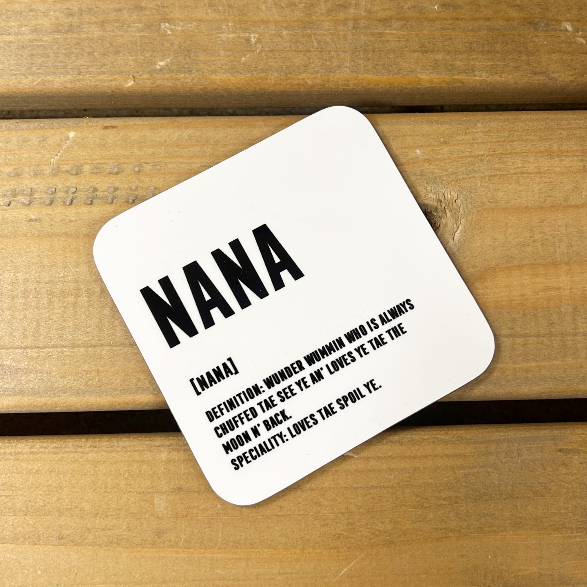 White gloss 9cm x 9cm coaster for Nana with black lettering and Scottish definition.