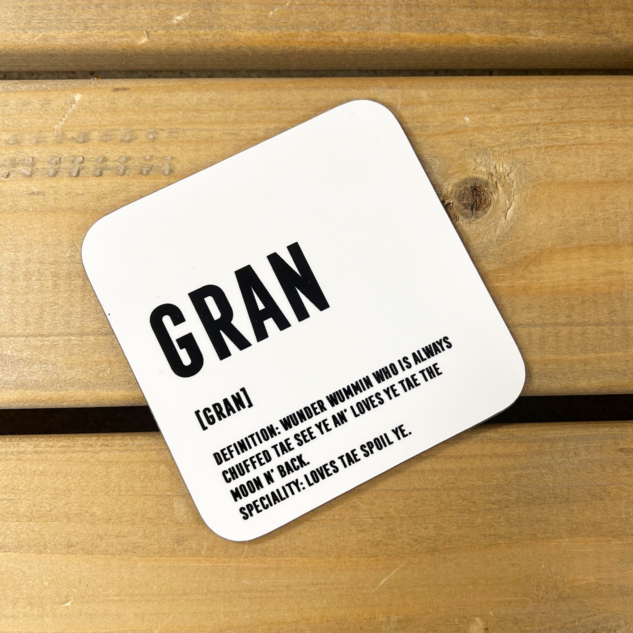 White gloss 9cm x 9cm coaster for Gran with black lettering and Scottish definition.