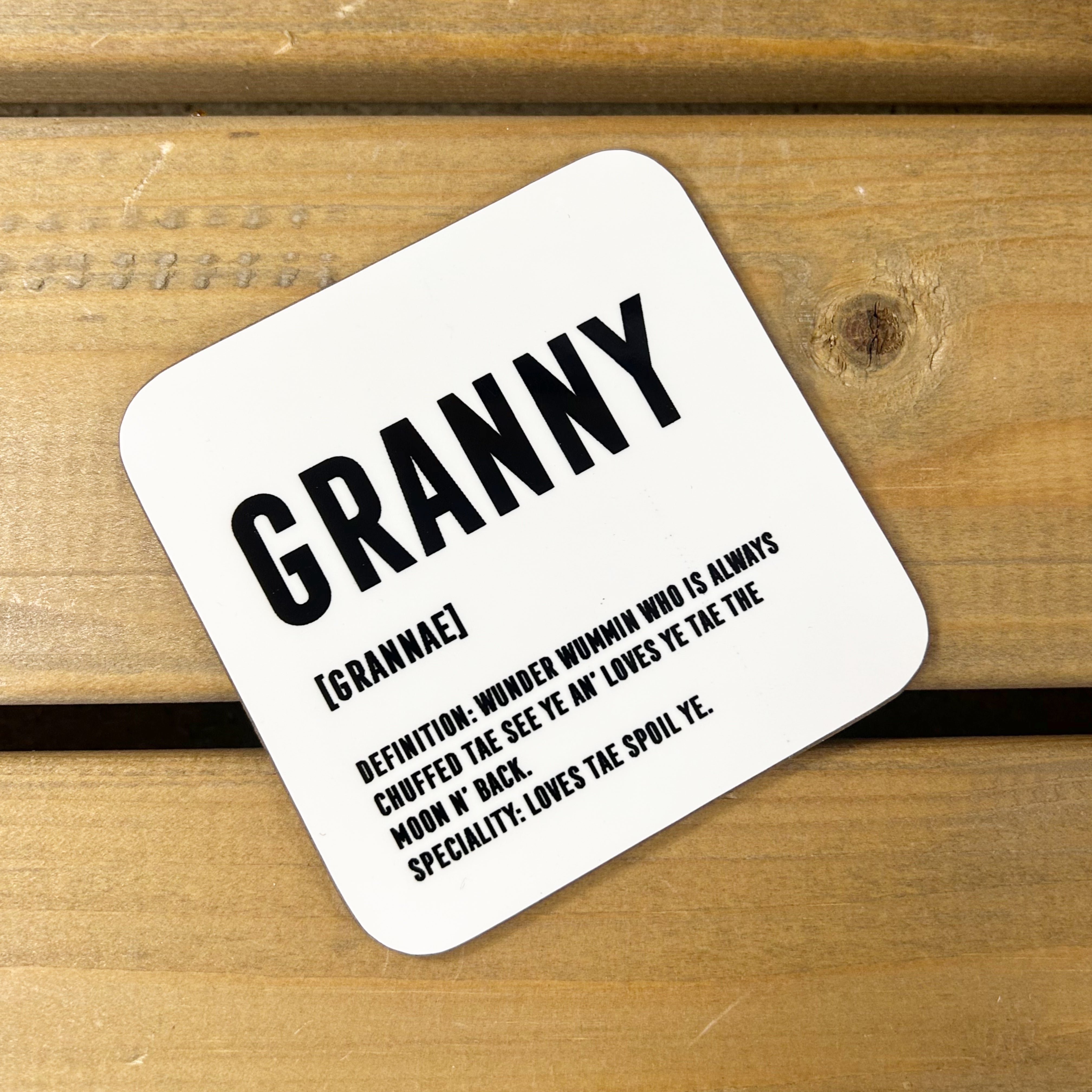White gloss 9cm x 9cm coaster for Granny with black lettering and Scottish definition.