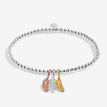 Joma jewellery stretch beaded bracelet with three hanging feather charms in silver, gold and rose gold plating presented on a foil stamped sentiment card.