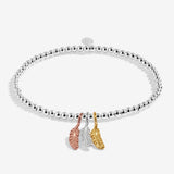 Joma jewellery stretch beaded bracelet with three hanging feather charms in silver, gold and rose gold plating presented on a foil stamped sentiment card.