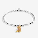 Joma Jewellery stretch beaded bracelet featuring a hanging cowgirl boot charm in gold plating presented on a foil stamped sentiment card.