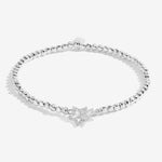 Joma Jewellery stretch beaded silver plated bracelet with intertwined star charm presented on blush pink foil stamped card.