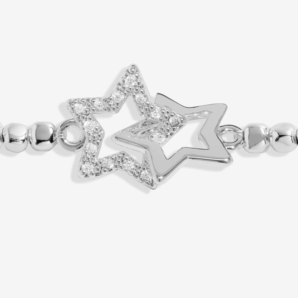 Joma Jewellery stretch beaded silver plated bracelet with intertwined star charm presented on blush pink foil stamped card.