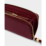 Katie Loxton large vegan leather purse in cherry with gold ton hardware.