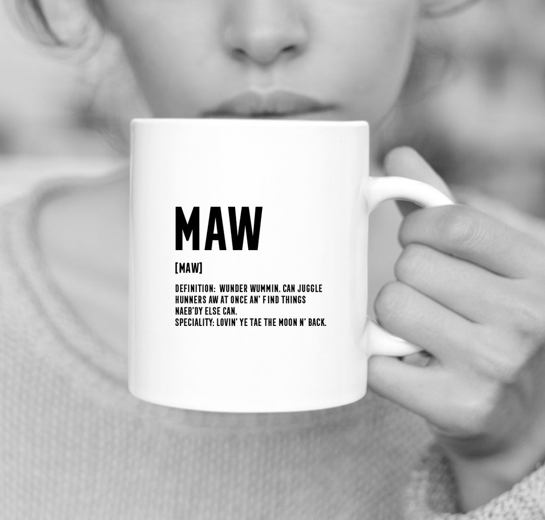 White porcelain mug with black lettering with Scottish definition of mum