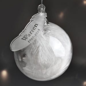 Glass bauble with feather tag