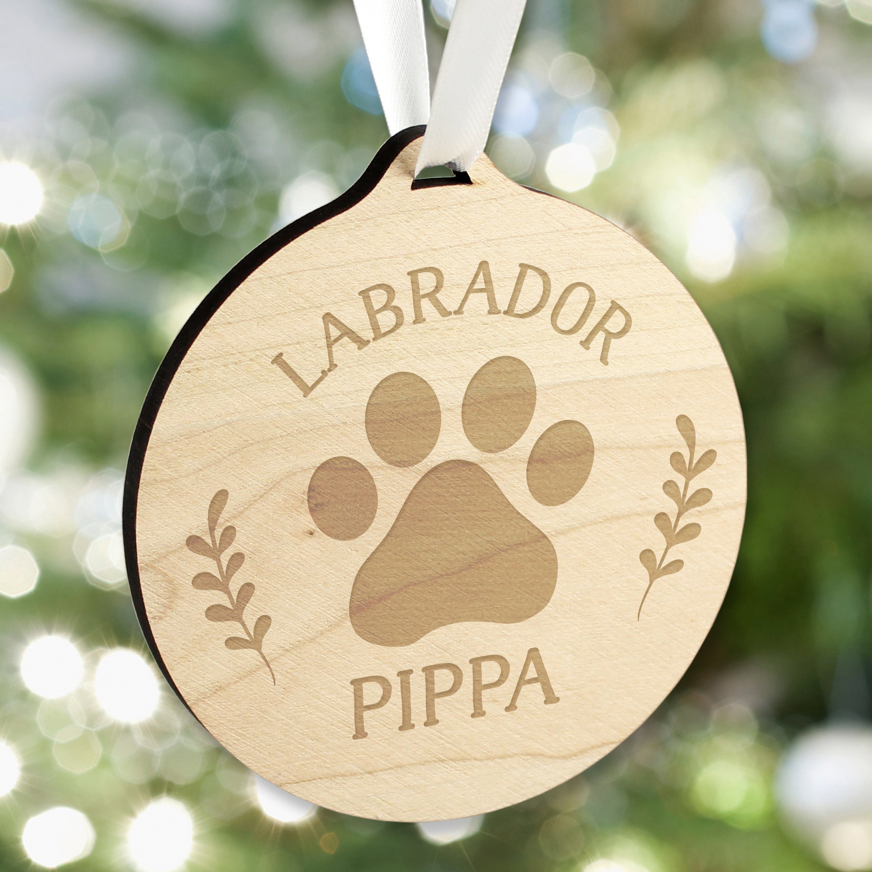 Wooden hanging Christmas decoration with paw print and personalised name