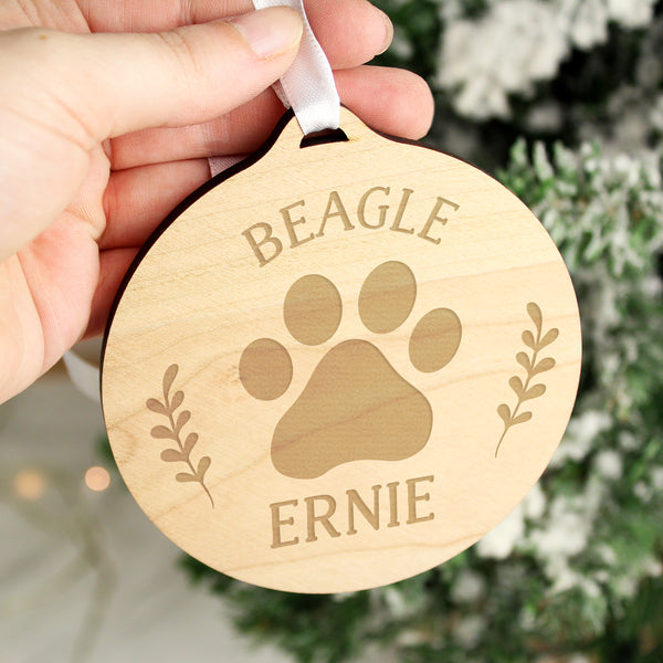 Wooden hanging Christmas decoration with paw print and personalised name