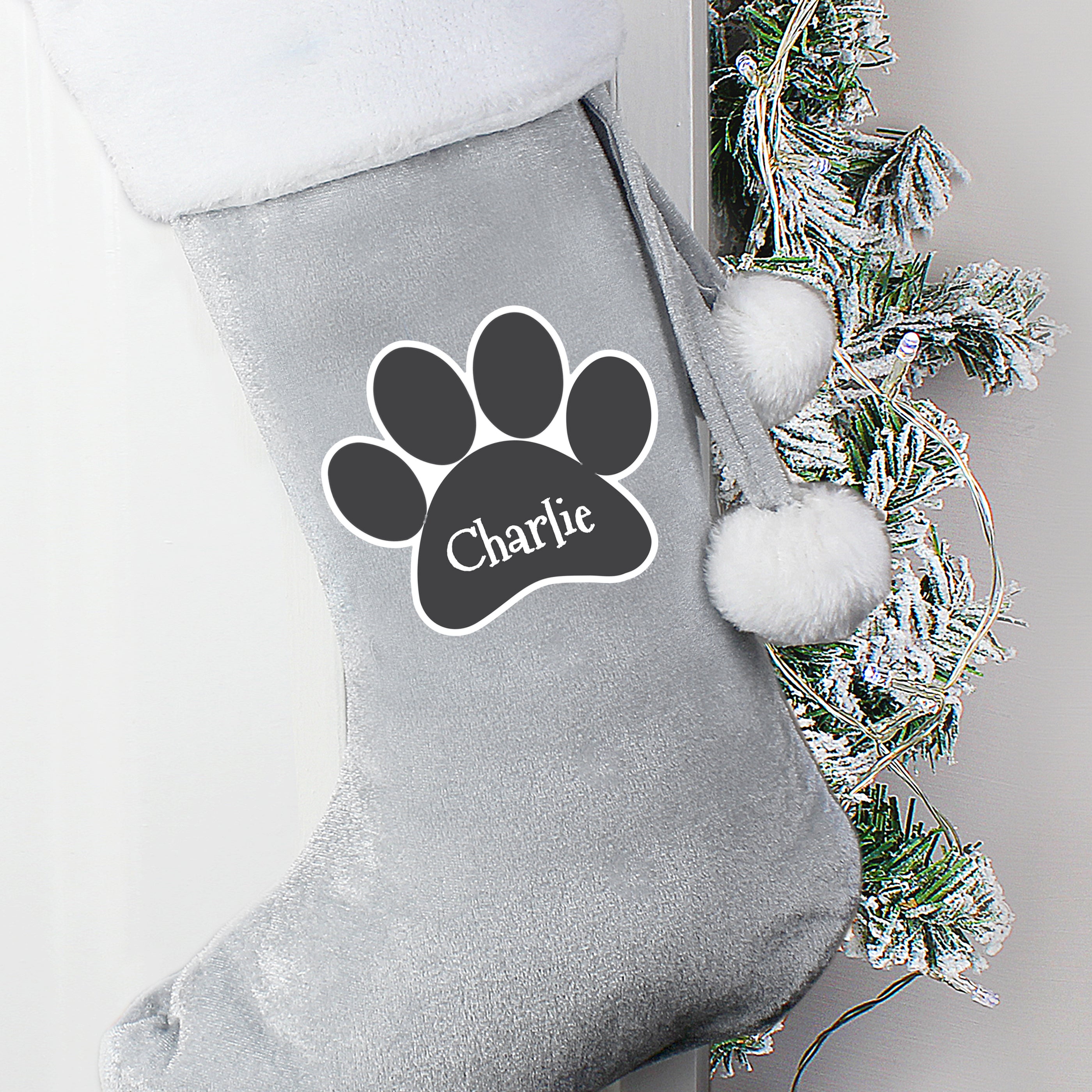Grey personalised Christmas stocking with paw pri