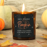 Personalised amber glass candle with pumpkin design.