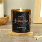 Personalised amber glass candle with pumpkin design.