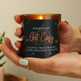 Personalised amber glass candle with pumpkin design.