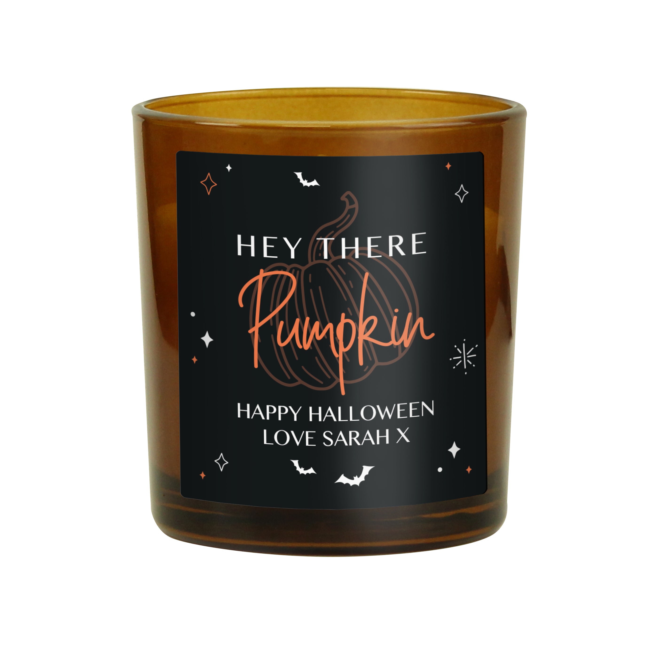Personalised amber glass candle with pumpkin design.