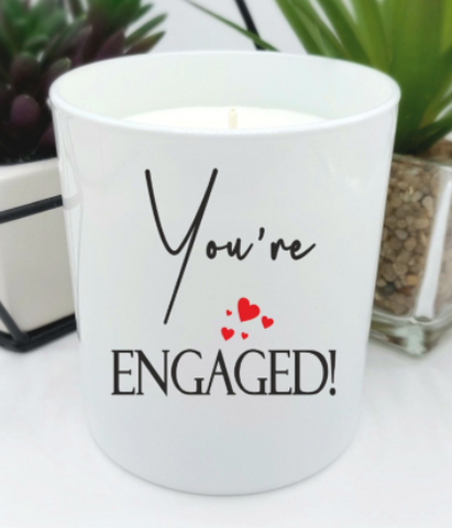 White gloss jar candle and black text you're engaged