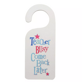 Wooden Door hanger for teachers saying Teacher busy come back later on white background.