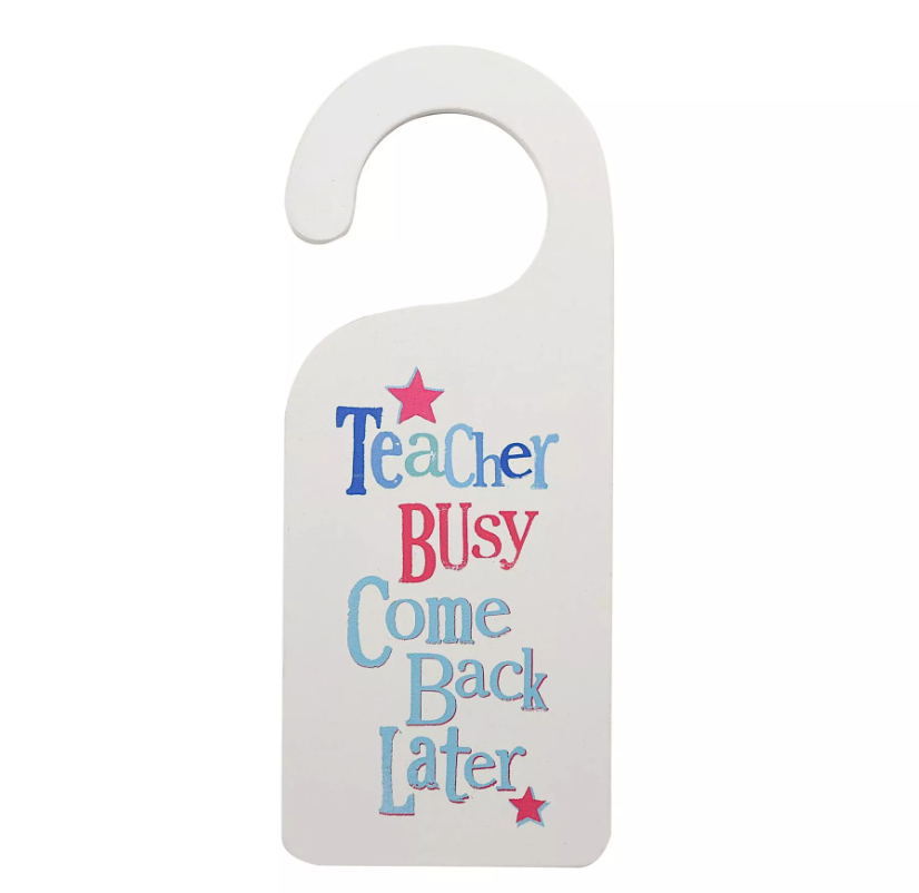 Wooden Door hanger for teachers saying Teacher busy come back later on white background.
