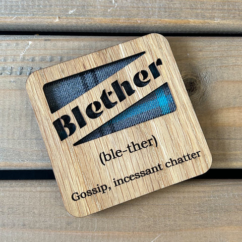Oak veneer coaster with tartan insert and cut out wording 'Blether' with engraved definition.