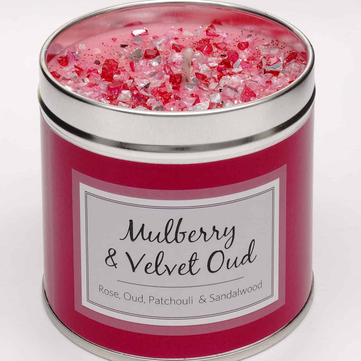 Tin scented mulberry and velvet oud candle with added sparkles