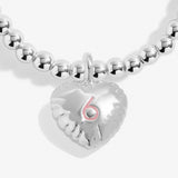 Joma jewellery silver plated girls birthday bracelet with hanging heart charm with 6 stamped in pink.