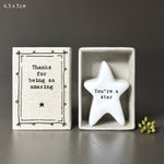 White porcelain star with the words 'You're a star' in black inside a matchbox with decorative black design and the wording 'Thanks for being amazing'.