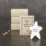 White porcelain star with the words 'You're a star' in black inside a matchbox with decorative black design and the wording 'Thanks for being amazing'.
