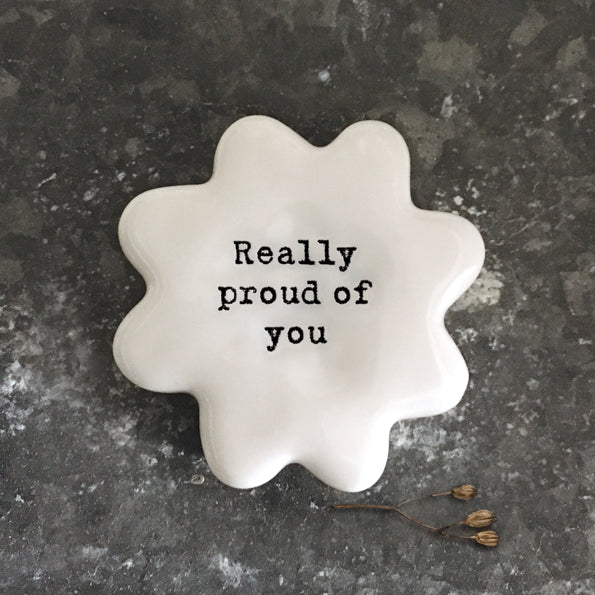 East Of India white porcelain token with black wording 'Really Proud Of You'