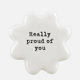 East Of India white porcelain token with black wording 'Really Proud Of You'